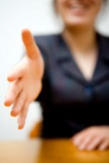 Offering hand in agreement